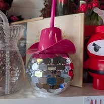 Candy Barn disco ball cup with pink cowboy hat straw — the perfect hens party treat