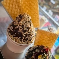Chocolate-dipped ice cream cones loaded with toppings at Candy Barn Whitsundays