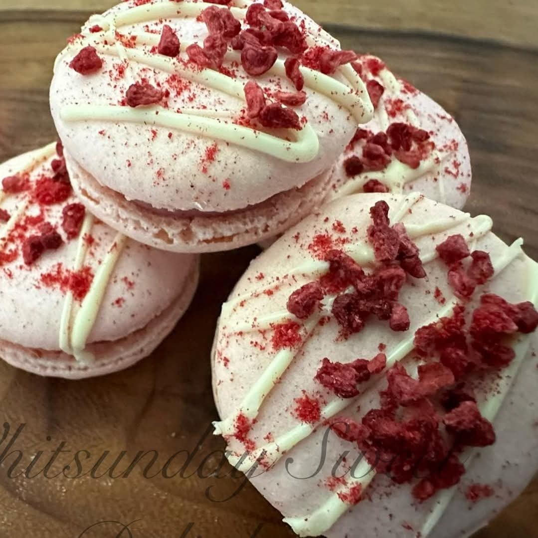 Whitsunday Sweet Delights — red velvet macarons with white chocolate drizzle